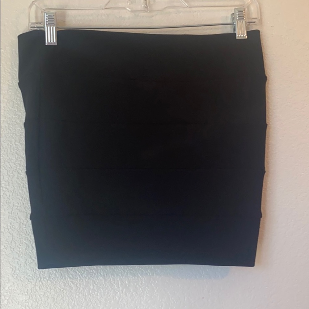 Black pleaded mini skirt